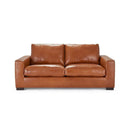 Front view of a Kennon contemporary leather loveseat in a tan or medium-brown color, featuring two large back cushions, two seat cushions, wide square arms, and low-profile dark block feet.