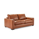 Three-quarters view of a Kennon contemporary leather loveseat in a tan or medium-brown color, featuring two large back cushions, two seat cushions, wide square arms, and low-profile dark block feet.
