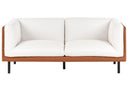 Off-white sofa with faux leather covering wooden frame on a white background