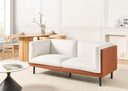 Off-hite sofa with brown faux leather covering wooden frame in a modern living room setting