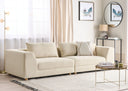 Light beige sofa in a living room with decor elements