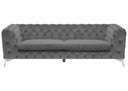 Grey velvet tufted sofa with chrome metal legs in a white background