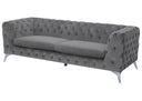 Gray tufted sofa on a white background