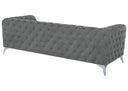 Gray tufted sofa on a white background