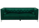 Luxurious emerald green velvet sofa, tufted and adorned with silver studs, includes matching bolster pillows on a white background.