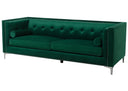 Green velvet sofa with nailhead trim on a white background