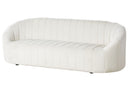 Off-white sofa with quilted design on a white background