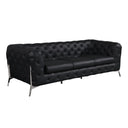 Three-quarters of a black tufted sofa with chrome legs on a white background.