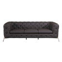 Front view of a brown tufted sofa with chrome legs on a white background.