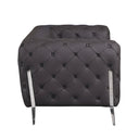 Side view of a brown tufted sofa with chrome legs on a white background.