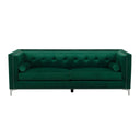 Front view of a luxurious emerald green velvet sofa, tufted and adorned with silver studs, includes matching bolster pillows on a white background.