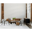 Modern living room with brown sofa, white chairs, and wooden coffee table.