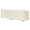 Three-quarters rear view of an off-white curved sofa on a white background.