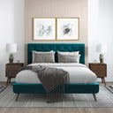 Modern bedroom with teal bed and wooden nightstands.