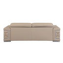 Rear view of a beige leather sofa with decorative armrests on a white background.