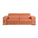 Front view of a camel leather sofa with decorative armrests on a white background.