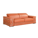 Three-quarters view of a camel leather sofa with decorative armrests on a white background.