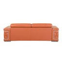 Rear view of a camel leather sofa with decorative armrests on a white background.