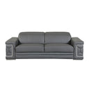 Front view of a grey leather sofa with decorative armrests on a white background.
