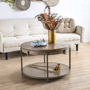 Round wooden coffee table with wooden legs in a living room setting.