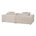 Three-quarters rear view of a beige sofa with cushions on a white background