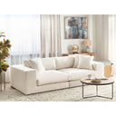 Off-white sofa in a living room with decor elements.