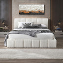 Modern bedroom with a white upholstered bed, decorative pillows, and a wall painting.