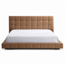 Tan tufted bed frame with white mattress on a white background