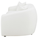 Side view of a white armchair on a white background.