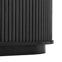 Black cylindrical object with ribbed texture on a white background