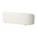 A three-quarters rear view of an off-white sofa with quilted design on a white background