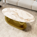 Marble coffee table with a gold base on a carpeted floor.