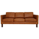 Front view of a cognac leather sofa on a white background.
