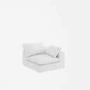 Three-quarters view of the right section of a white loveseat with cushions on a white background.
