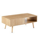 Rear view of a wooden coffee table with storage compartments on a white background.