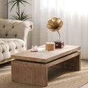 Wooden coffee table with decorative items in a living room setting