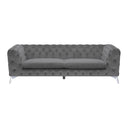 Front view of a Sotra contemporary sofa in grey velvet, featuring all-over diamond button tufting on the low back and arms, two smooth seat cushions, and sleek, angled chrome legs.