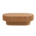 Front view of a natural ash round wooden coffee table with a ribbed surface on a white background.