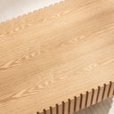 Close-up of the natural ash coffee table top with ribbed edges.