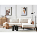 Modern living room with a beige sectional sofa, coffee table, and abstract art on the walls.