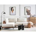 Modern living room with a beige sectional sofa, coffee table, and wall art.