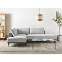 Modern living room with a right gray sectional sofa, coffee table, and decorative items.