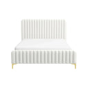 White upholstered bed with a pleated design on a white background