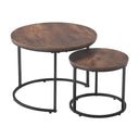 Set of two round wooden tables with metal bases on a white background