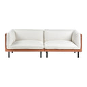 Front view of an off-white sofa with brown leather covered wooden frame with black metal legs on a white background.