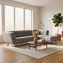 Adele 103-inch ash grey fabric right-facing sectional sofa with grid tufting and tapered wooden legs in a sunlit modern living room setting.