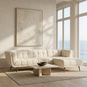 Adele 103-inch cream bouclé right-facing sectional sofa with grid tufting and tapered wood legs in a sunlit modern living room with ocean view windows