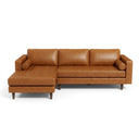 Anita 102-inch mid-century modern left-facing sectional sofa in tan genuine top grain leather featuring grid-tufted seats, cylindrical bolster pillows, and tapered wooden legs against a white background.