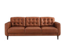 Front view of the Armando mid-century modern sofa in caramel leather, featuring biscuit-tufted back cushions and dark tapered legs, on a white background.