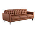 A three-quarter view of the Armando leather sofa, highlighting the biscuit-tufted back, the clean lines of its track arm, and its rich caramel color.